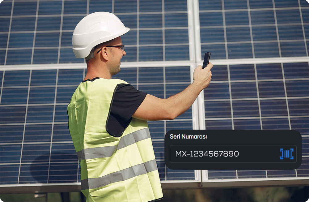 Technician reviewing module data for solar asset management